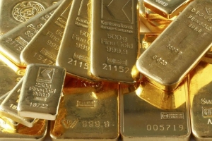 الذهب يتراجع مع ارتفاع الدولار بفعل موقف الإحتياطي الفيدرالي