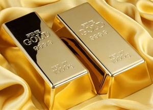 الذهب يستقر مع تراجع الدولار ، ولايزال في طريقه لتسجيل انخفاض شهري
