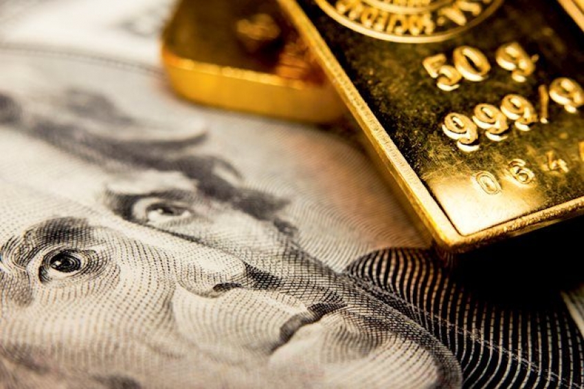 الذهب مقيد بنطاق محدد بفعل قوة الدولار ، وتوترات رفع أسعار الفائدة الفيدرالية