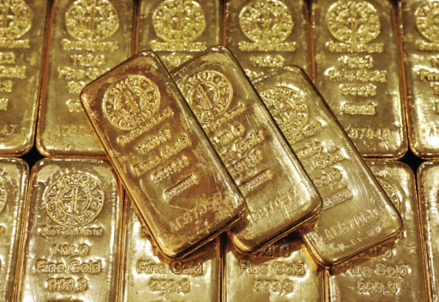 الذهب ينخفض مع صعود الدولار مقابل اليورو بعد قرار سياسة البنك المركزي الاوروبي